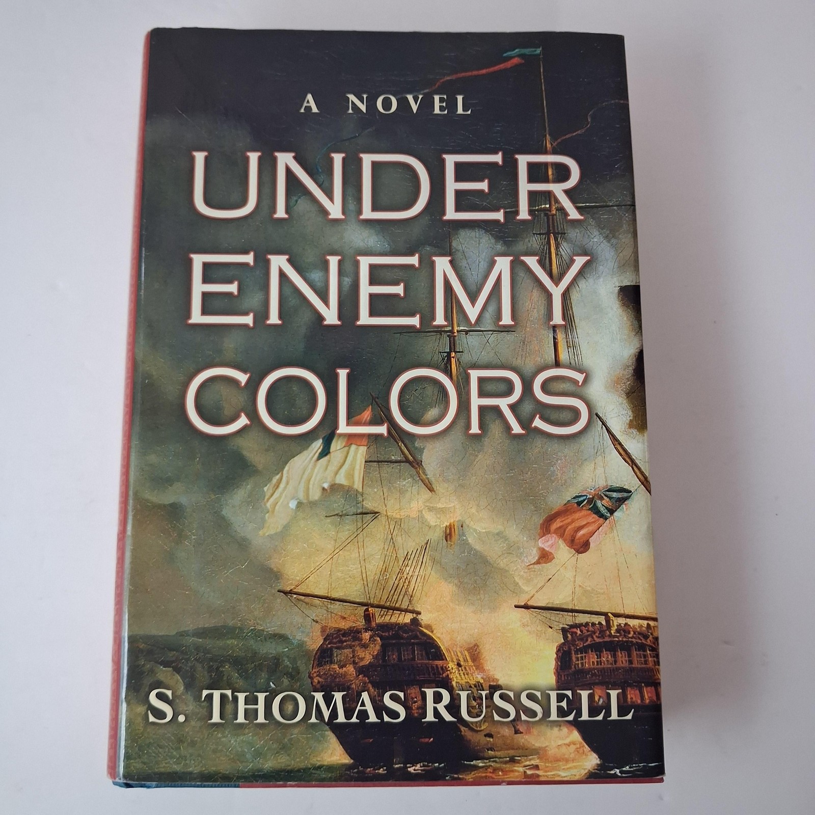 Under Enemy Colors Sean Thomas Russell G.P. Putnam’s Sons Red HC DJ 2007 USA
