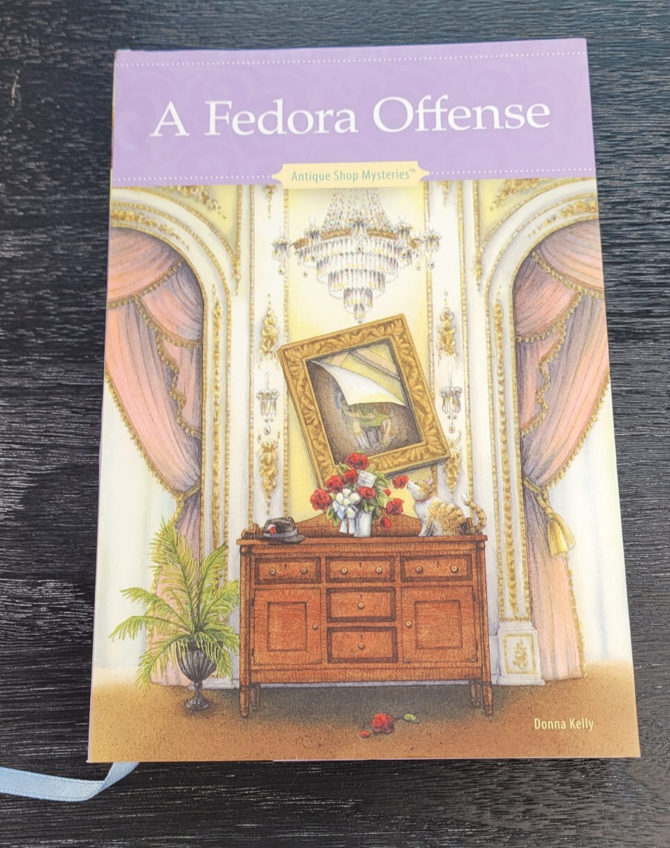 A Fedora Offense by Donna Kelly Annie’s Antique Shop Mysteries