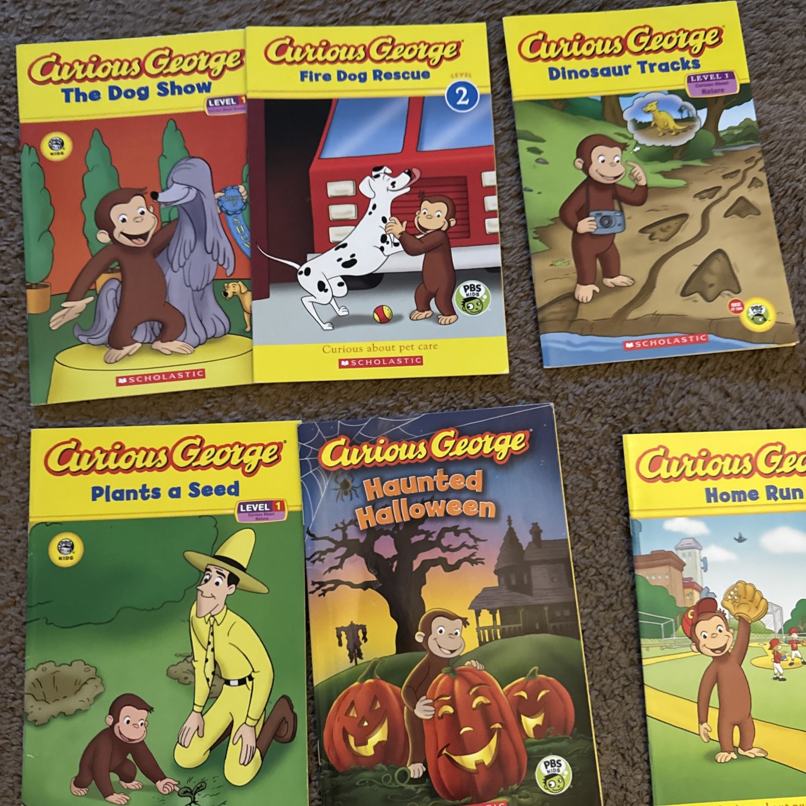 10 Scholastic “Curious George” children’s paperback books, Level 1 readers